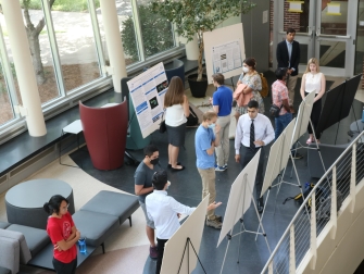 Students conduct poster sessions during 2022's Summer Research Experience for Undergraduates (REU) in the Ford Environmental Science and Technology building. (Photo Renay San Miguel)